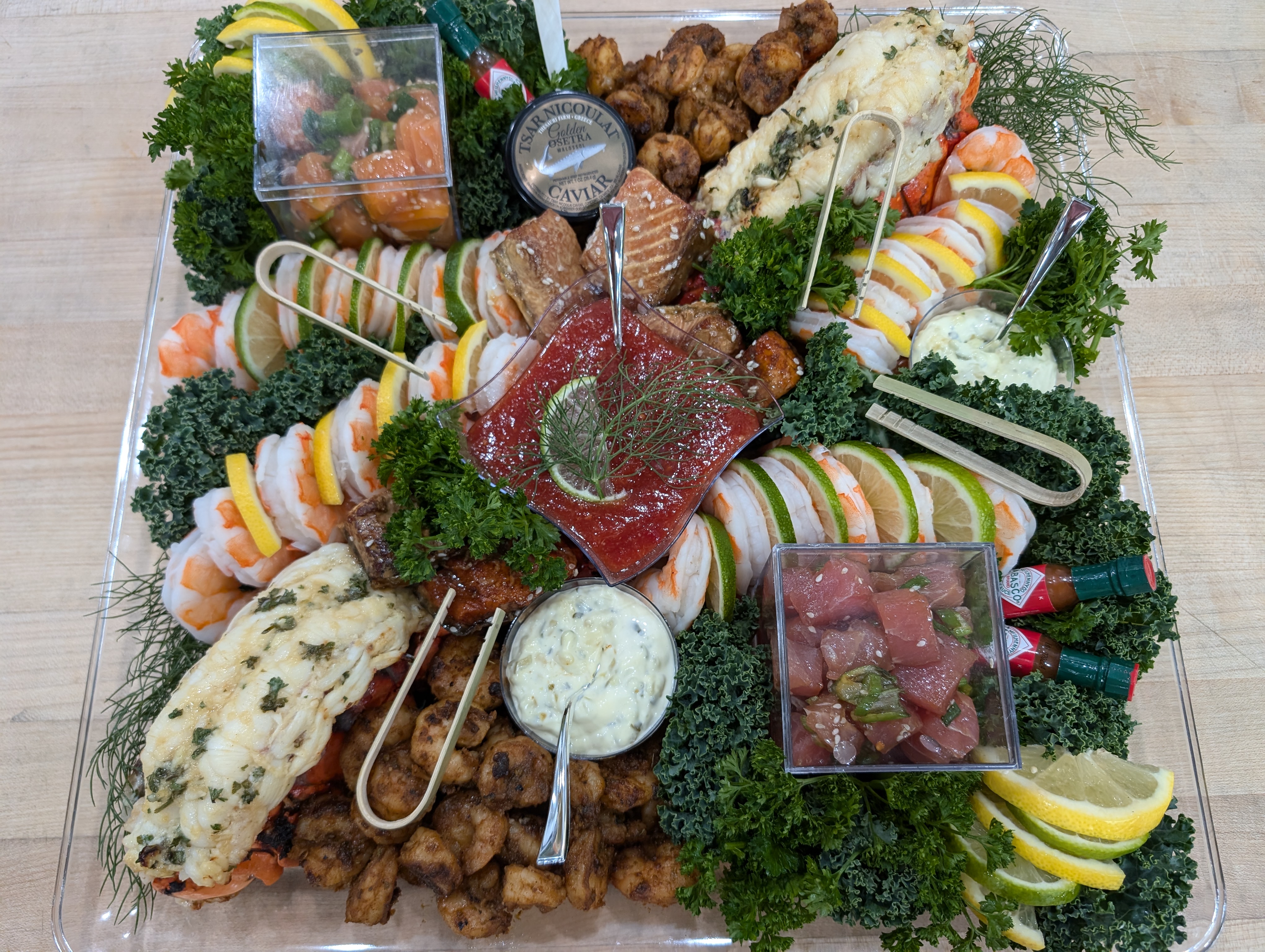 ACN premium seafood catering display with lobster, caviar, chilled shrimp, and tuna